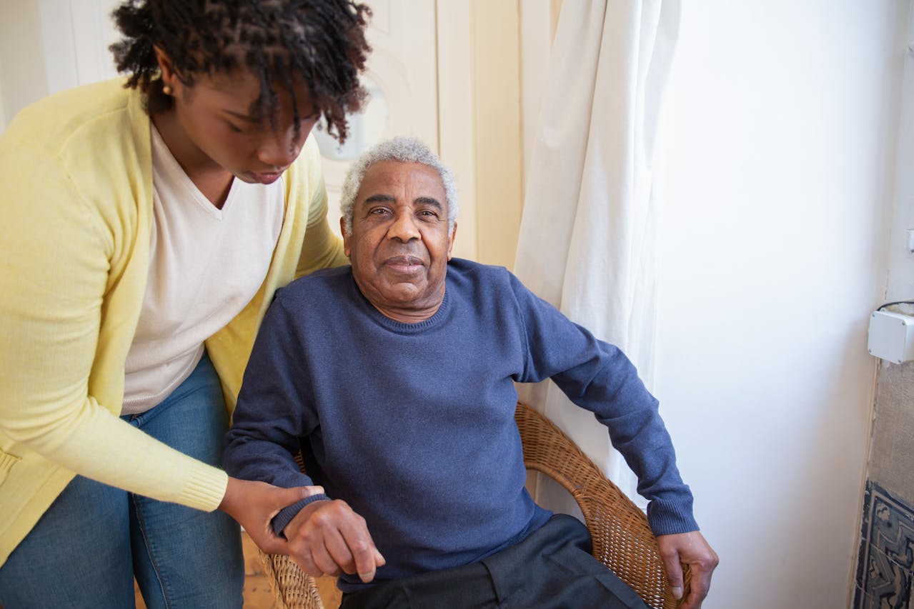 Photo by Kampus Production: https://www.pexels.com/photo/woman-assisting-elderly-man-7551667/