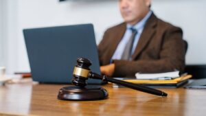Photo by Sora Shimazaki: https://www.pexels.com/photo/crop-asian-judge-working-on-laptop-in-office-5668772/